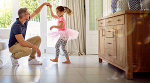 Dad dancing with daughter